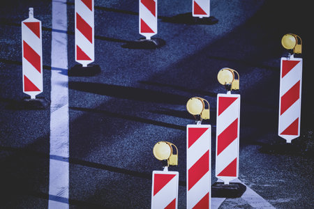 Safety bollards on a road under repairの写真素材