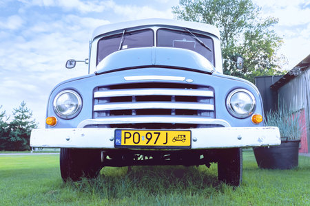 Polish yellow number plate on a vintage car - yellow number plates in Poland are reserved for classic and retro cars.のeditorial素材