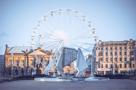 Poznan, Poland - a Ferris wheel at the Freedom Square on a sunny winter day.のeditorial素材