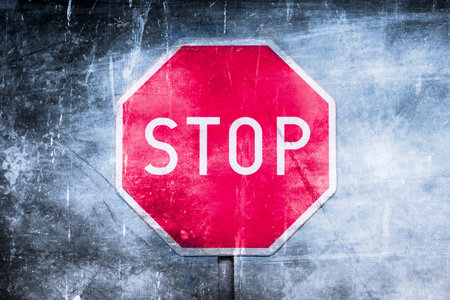 Stop road sign with an abstract gritty, grungy texture overlay.の写真素材