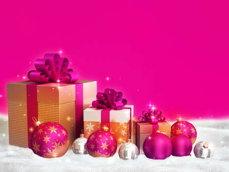 Merry christmas theme - pink christmas balls, golden gift boxes with bows on pink background and free space for text.の写真素材