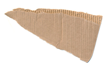 Torn piece of cardboard. Blank paper piece for message, reminder, sign, tag, label. Corrugated ripped cardboard empty background for message. Isolated on white background. Design element. Copy spaceの写真素材