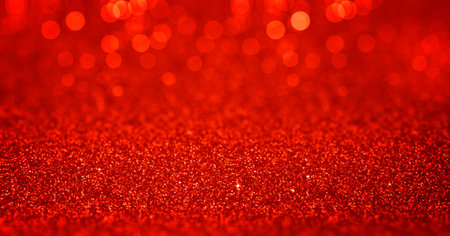 Sparkling red gold glitter background with bokeh, dof. February 14th valentines day backdrop. Pattern with shining fine red sequins. Festive luxury background, backdrop, texture. Design elementの写真素材