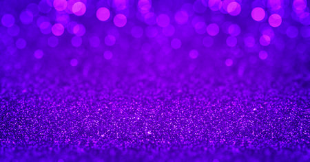 Sparkling purple glitter background with magenta bokeh. Closeup view, dof. Pattern with shining fine purple sequins. Festive luxury magenta background, backdrop, texture. Design elementの写真素材