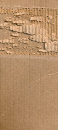 Wallpaper torn cardboard. Paperboard paper ripped frame, border. Corrugated torn cardboard empty background, realistic texture. Ragged vertical vintage retro stylish wallpaper. Copy spaceの写真素材