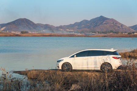 Modern white car by the lakeのeditorial素材