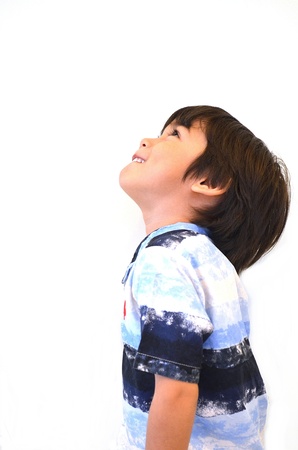 A little boy looking upの写真素材