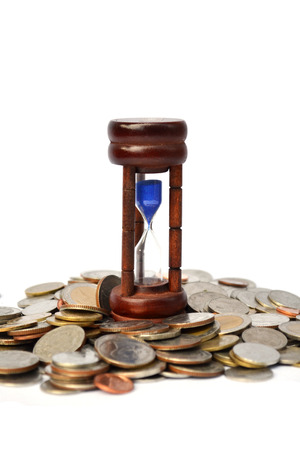 Time is money coins with sandwatch on white background