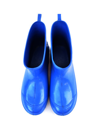 Blue boots on white の写真素材