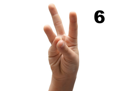 Number 6  kid hand spelling american sign language ASL on white の写真素材
