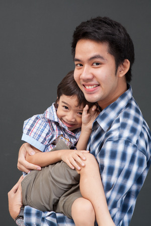 Older Brother playing with little brotherの写真素材