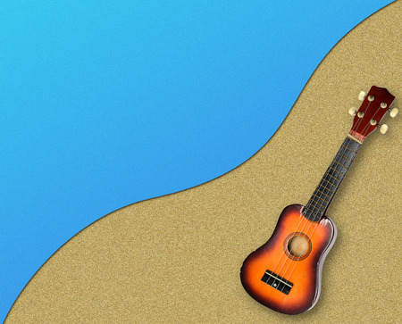 Sandy beach background. Detailed sand texture with guitarの写真素材