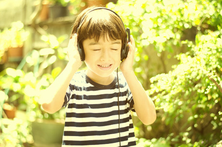 Little boy listening the sound of nature vintage styleの写真素材