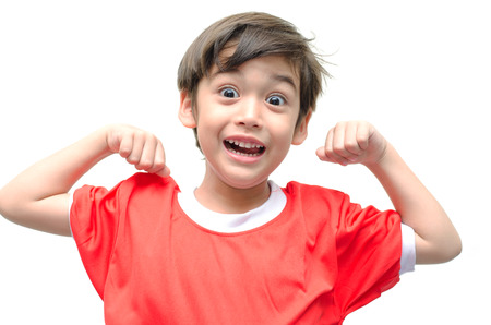 Little boy showing his muscles on white backgroundの写真素材
