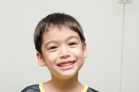 Little boy smiling portrait on white background