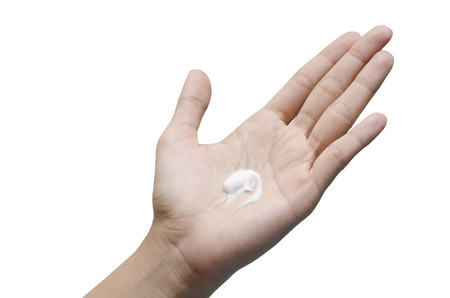 woman caring hand with lotion massage on white backgroundの写真素材