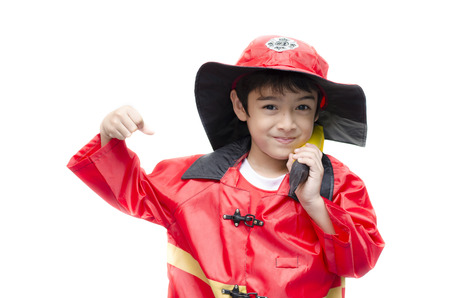 Little boy pretend as a fire fighter on white backgroundの写真素材