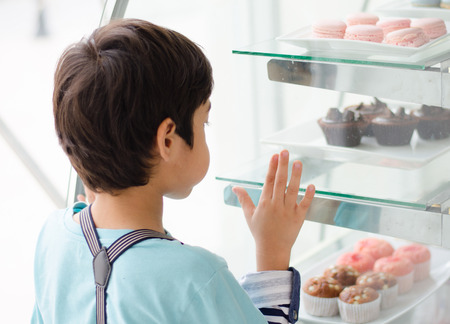 Little boy at the bakery shopの写真素材