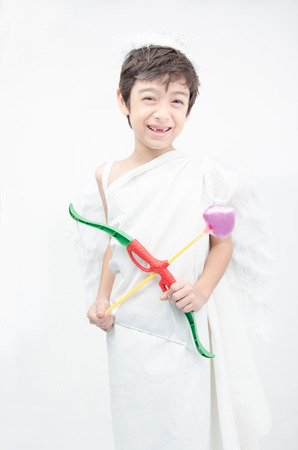 Little boy portrait pretend as cupid with wing