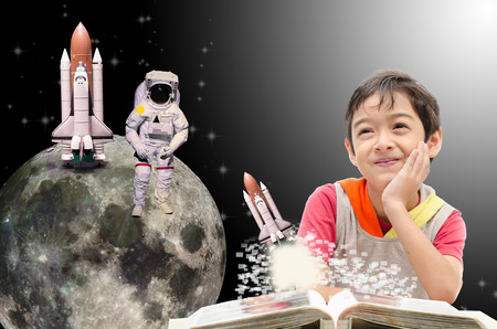 Little boy dreaming  about his future out of spaceの写真素材
