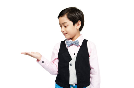 littly boy showing empty hand up on white backgroundの写真素材