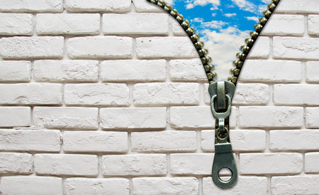 opened zipper from wall to the sky business conceptの写真素材