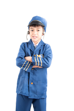 Little boy pretend as a pilot on white backgroundの写真素材