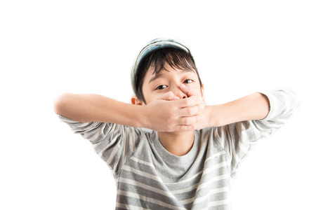 Little boy hand closing mouth on white background
