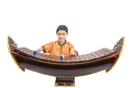 Little boy learning Thai classical xylophone instumentの写真素材