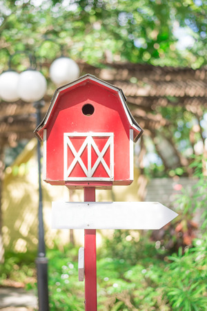 Bird house with empty arrow signの写真素材
