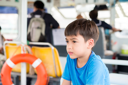 Little boy sitting in ferryの写真素材