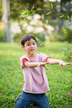 Little boy smiling in the park in summer timeの写真素材