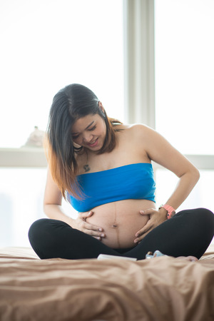 Pregnancy belly skin close up sittingの写真素材