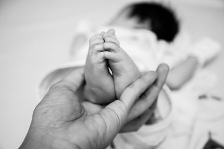 Close up baby feet new born black and whiteの写真素材