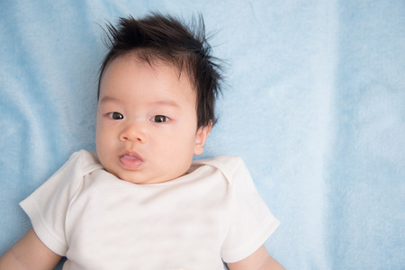 Close up portriat of Asain baby infant 2 months old eye contact
