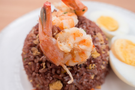 Fired brown rice with shrimp, carrot  and boiled egg healthy clean food none oil added low fatの写真素材