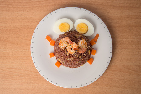 Fired brown rice with shrimp, carrot  and boiled egg healthy clean food none oil added low fatの写真素材