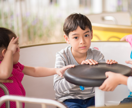 Children in amusement parkの写真素材