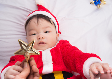 Asian Infant Baby in santa costume christmas celebrationの写真素材