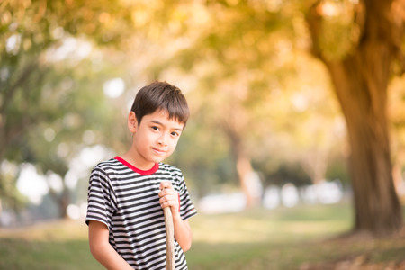 Close up asian boy sitting in th park の写真素材