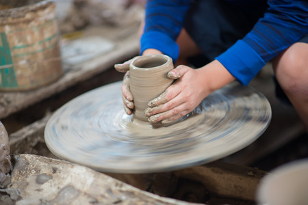boy molding ceramic pottery design