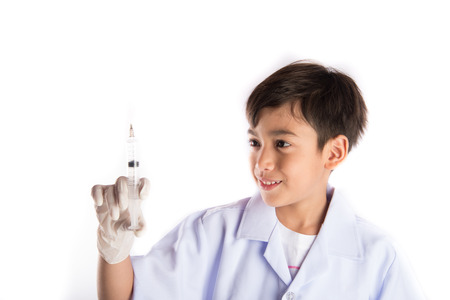 Little boy taking injection syring drugの写真素材