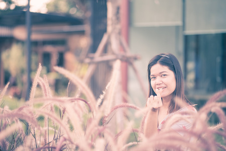 Middle age of asian worman portrait in the parkの写真素材
