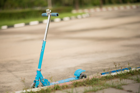 scooter riding in the park outdoorの写真素材