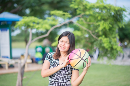 Single mom Mother and son play football together in the parkの写真素材