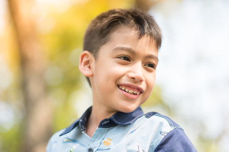 Close up face of liitle boy  Portrait photo in the parkの写真素材