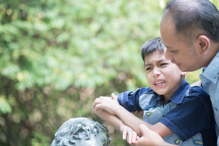 Father and son talking with angry mood child having problem his feelingの写真素材