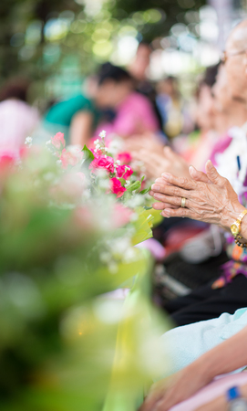 The younger traditionally sprinkle water onto their parents' and grandparents' handsの写真素材