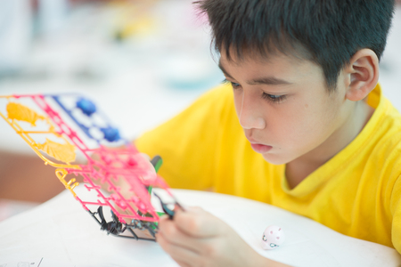 Little boy build model kits toy depicting the vehicles and characters of the fictional