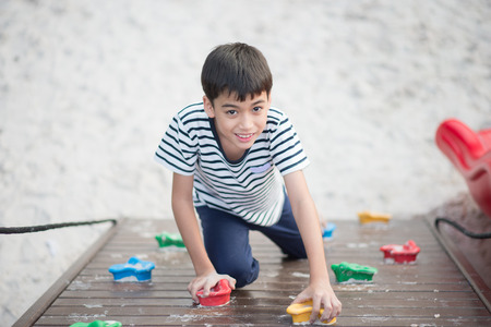 Little friendship sibling boy play together at playground outdoorの写真素材
